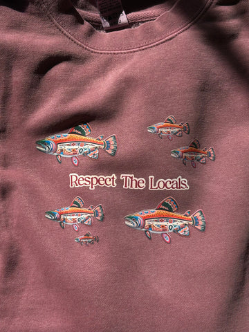 Maroon unisex sweatshirt with colorful salmon designs and 'Respect The Locals' text on a brown background.
