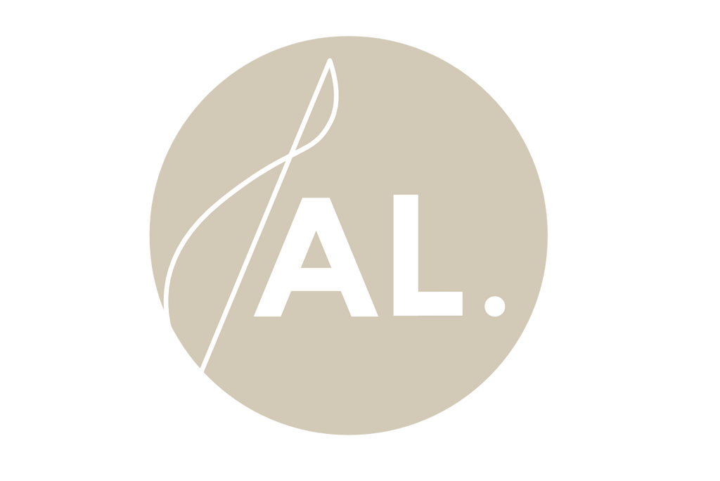 Beige circular Alchemy wellness co. logo with the initials A and L followed by a period representing the inclusivity Alchemys slogan "alchemy, for all." 