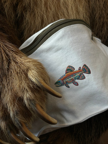 White pouch with a colorful fish design on fur