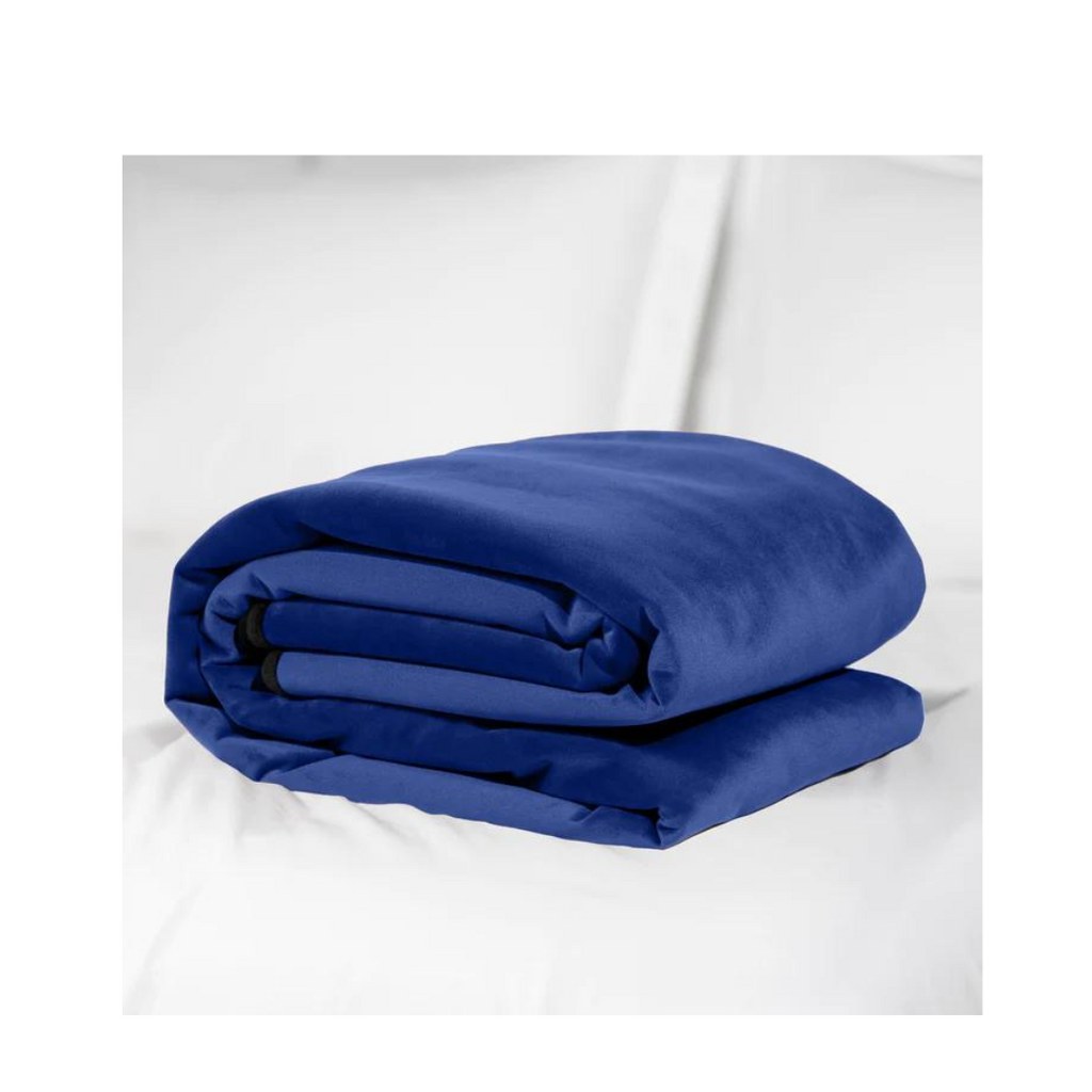 Royal blue microvelvet splash proof blanket by Liberator. A sexual wellness essential for anyone who squirts and for an easy clean up. Blanket is neatly folded displayed against a solid white background. 