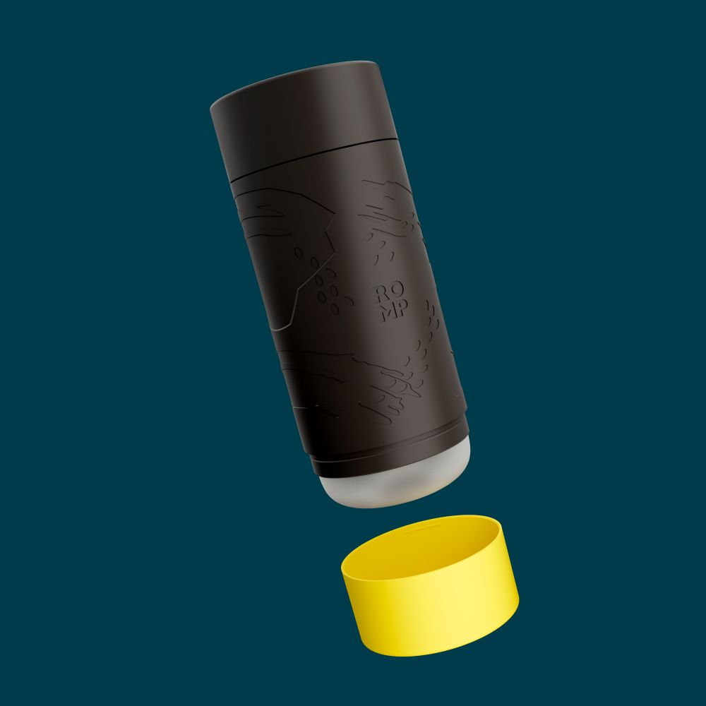 Product display showcasing Romp Dash Manuel Stroker by Wow Tech. Stroker is black with yellow base positioned vertically and centred against a Dark green background. Manuel stroker is displayed with the cap off. 