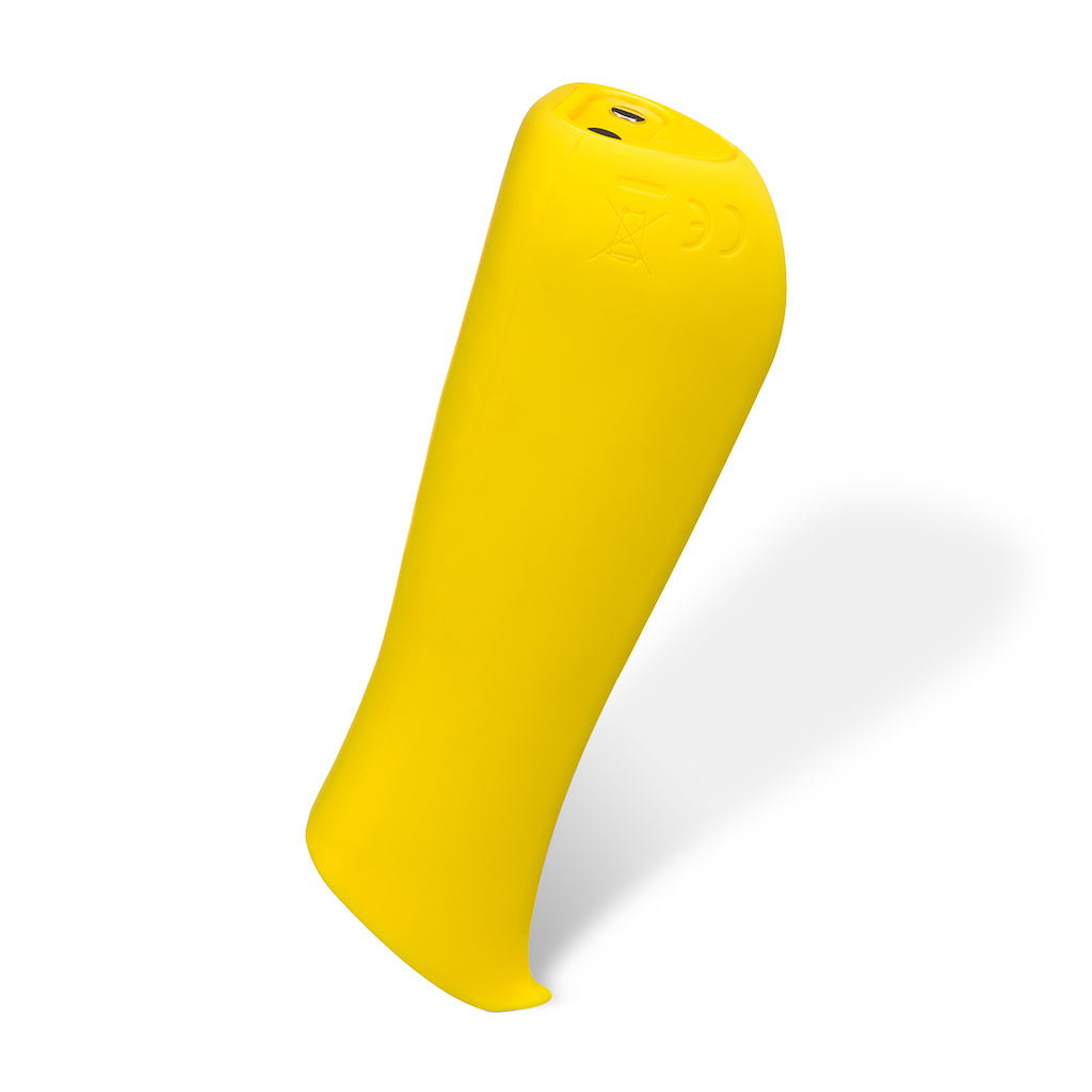 Prism shaped intimate massage Kip in lemon by Dame displayed standing vertically on solid white background.