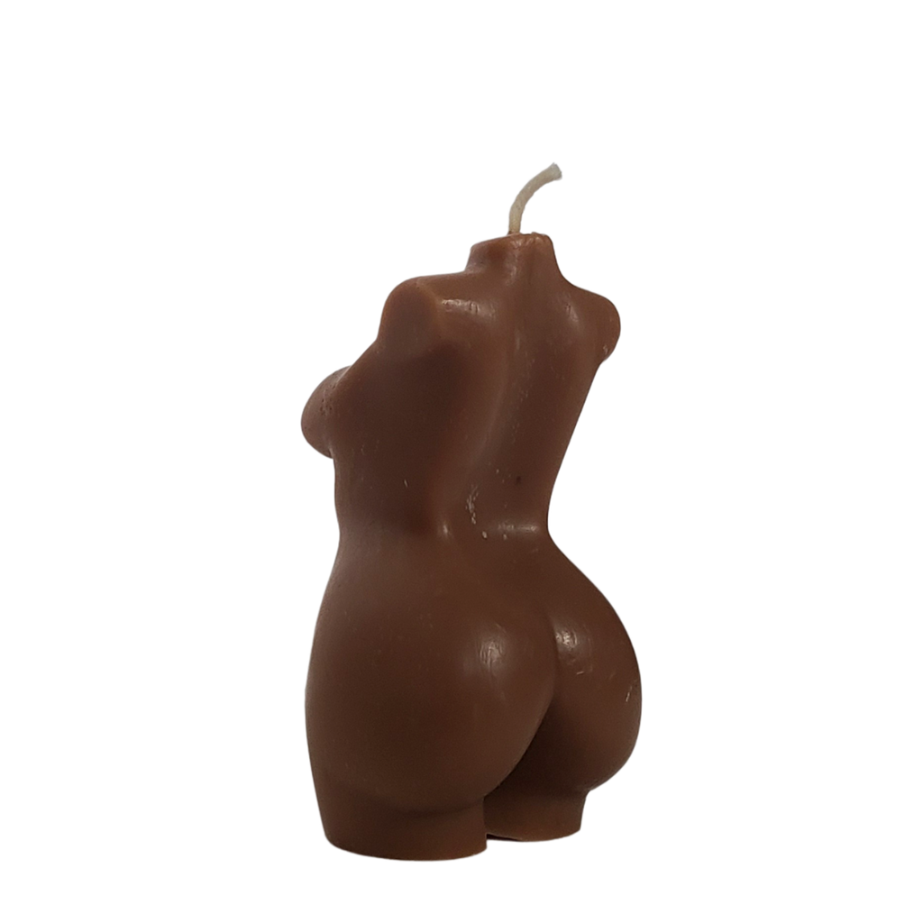Back profile of hand poured chocolate brown female form body shaped candledisplayed against a solid white background