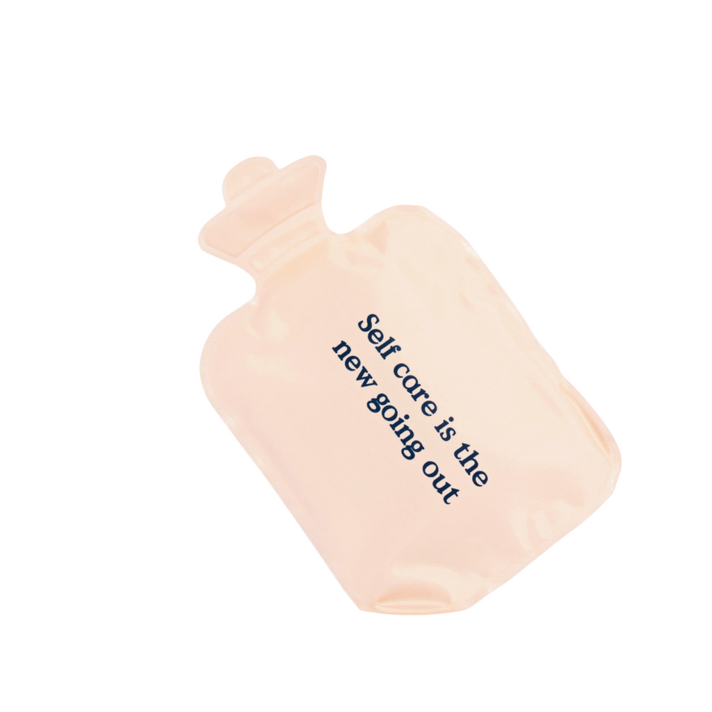 Light pink heating pack for period wellness by Blume displayed on solid white background. 