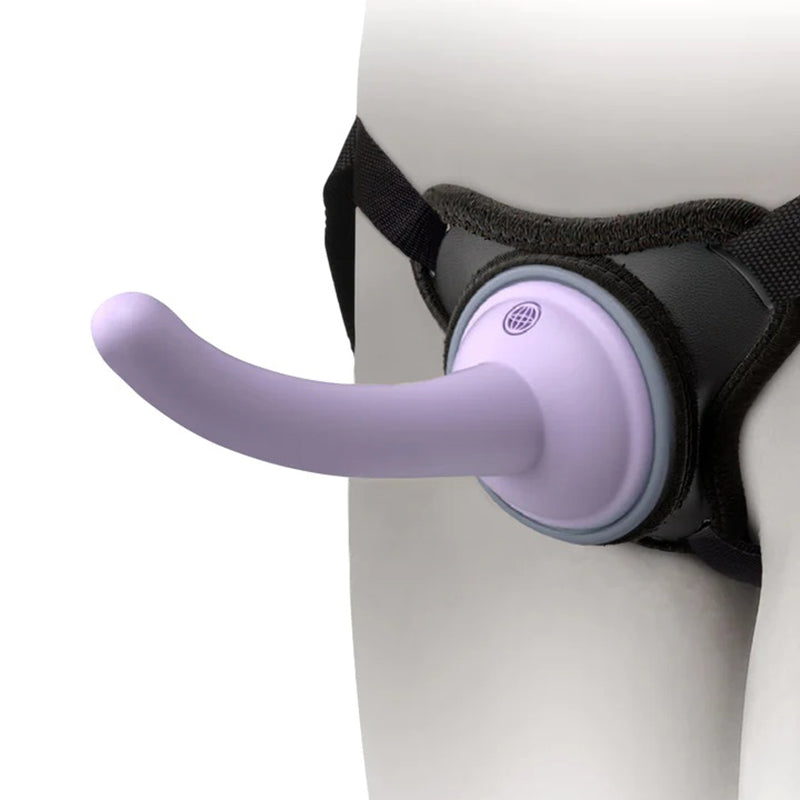 Dillio Universal Pegging Kit pictured being worn around pelvis. against white background. The Harness is adjustable and comes with a 5" light purple dildo that suctions at the base. Dillio makes gender neutral, beginner friendly pegging and lgbtqia sexual wellness and pleasure products.