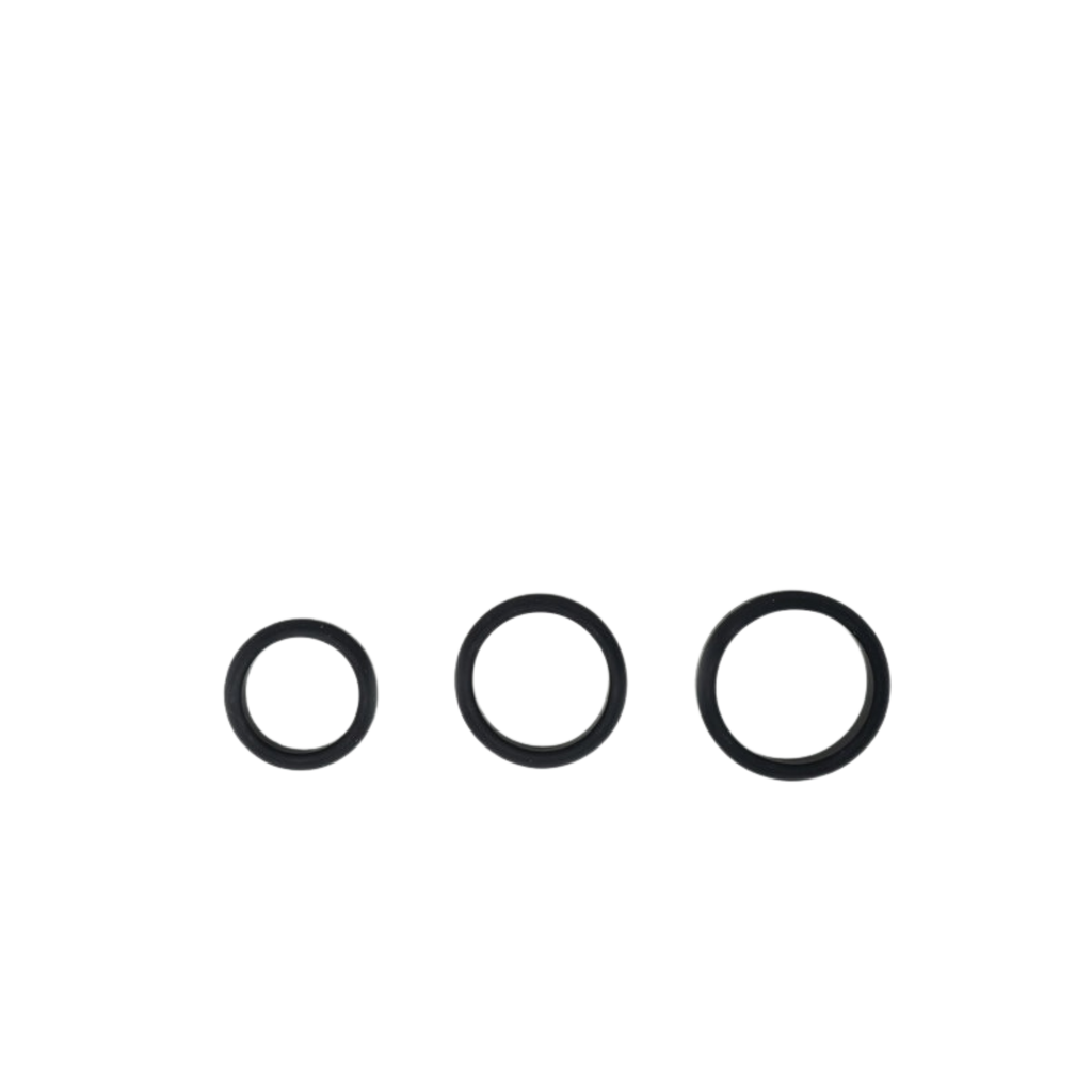 Three multisized silicon cock rings by Wednesday Co laid on solid white background in gradually increasing sizes. 