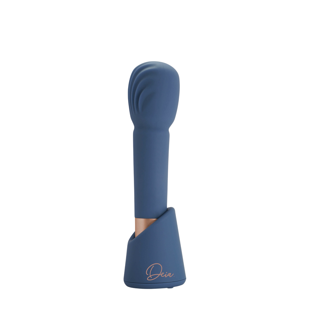 Navy blue Deia Arouser clitoral stimulator vertically standing in base in front of white background.