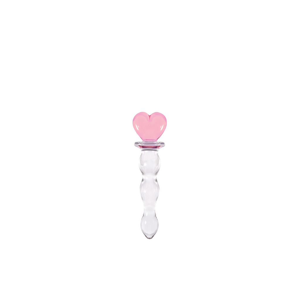 small glass heart shaped butt plug displayed in front of white background. 