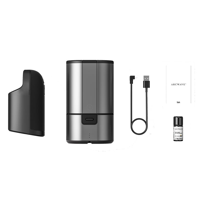 Mens personal stroker and masturbator technology by Arcwave being displayed outside of box in front of solid whit background.  Arc wave features an insertable component for penis owners and a carrying case with the product box in the center. 